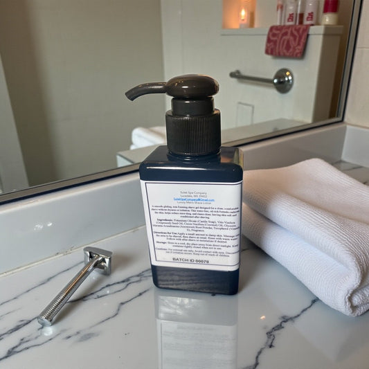 Luxury Men’s Shave Gel in a pump bottle on a bathroom countertop, an oil-rich, waterless shave gel designed for a smooth, controlled shave with a clean finish
